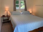 Main level guest room with King bed